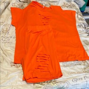 Vibrant Orange Jumpsuit with Distressed Details